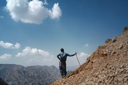 Pourang Mokhtari watches over the family's goats and sheep high in the Zagros Mountains.