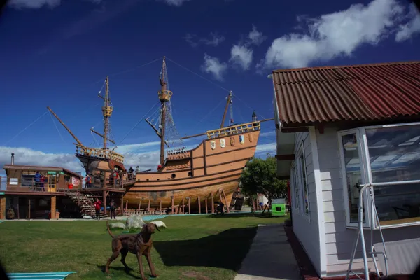 A nice composition---old sailing ship (type that went through Straits of Magellan), old shack, dog statue---in Punta Arenas at Straits of Magellan.  Camera: Sony A6000. thumbnail