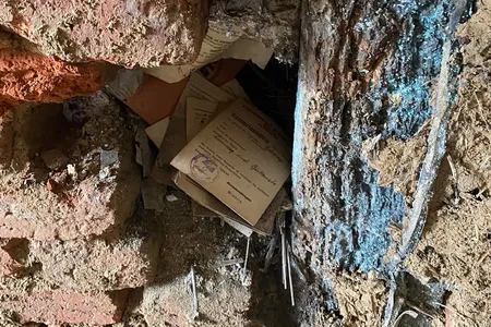 Finds ranged from a portrait of Adolf Hitler to a revolver, gas masks, Nazi Party badges, brass knuckles, letters and documents.