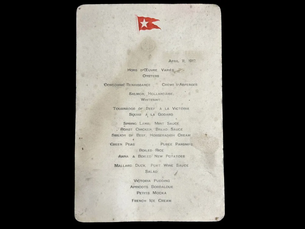 Piece of white paper with smudges and a red flag at the top