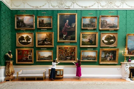 Curators put the finishing touches to Johan Zoffany&rsquo;s The Tribuna of the Uffizi&nbsp;in the Picture Gallery at Buckingham Palace.