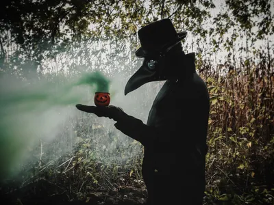 The green gas emanating from this small jack-o&rsquo;-lantern alludes to the spread of Covid-19. Fittingly, the photographer&rsquo;s subject dons a beaked mask based on the ones worn by physicians treating bubonic plague victims in 17th-century Europe.