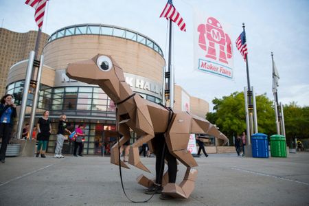 An open source cardboard dino from KitRex stands outside the New York Hall of Science during the World Maker Faire in September 2014.