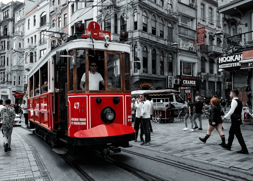 Taksim is the beating heart of Istanbul and Istiklal Caddesi is its main artery. Then the red heritage tram, is the blood circulating through it's veins.