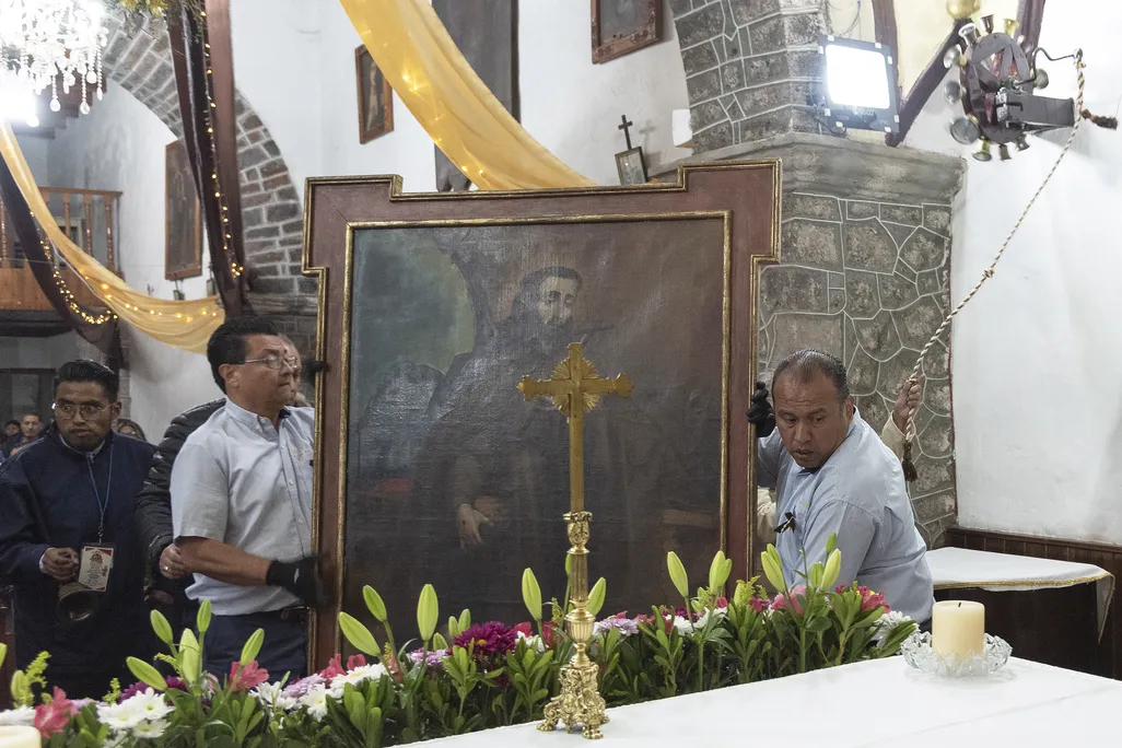 Men carrying a painting