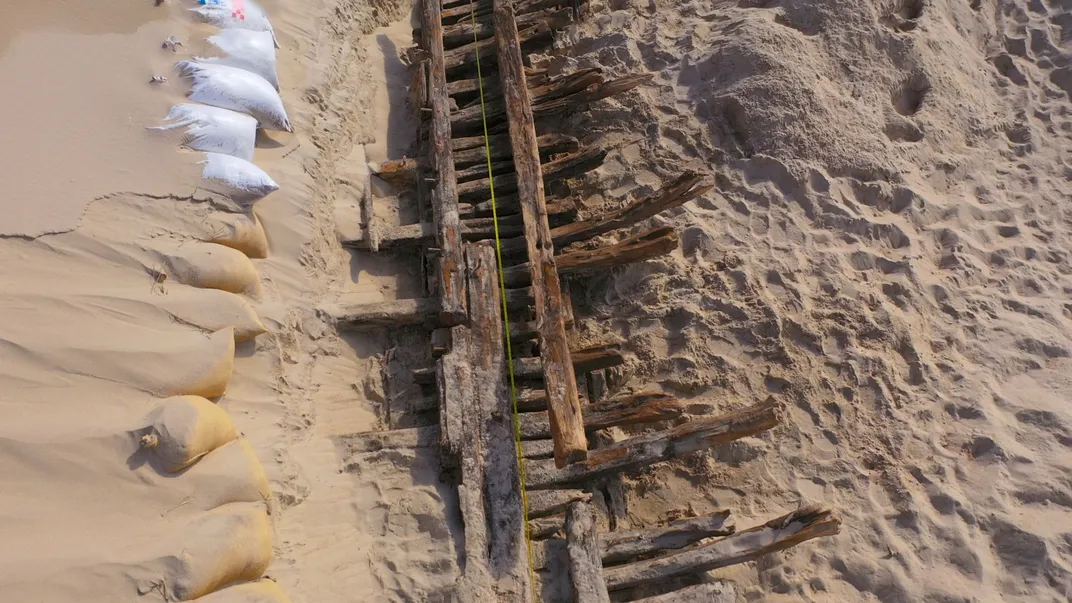 Shipwreck timbers in sand