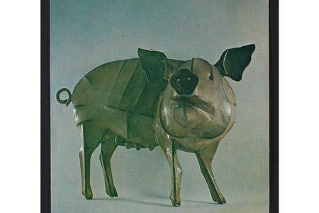 Sculptor Anne Arnold and her husband, the abstract painter Ernest Briggs, owned a house with a barn in Montville, Maine, where they raised farm animals, including pigs, cows, and chickens, and kept many dogs and cats. Arnold frequently relied on photographs of her menagerie to create her lively sculptures of animals in metal and wood.