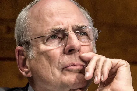 Augustine listens to a question from the audience at a meeting of the Human Space Flight Plans Committee in 2009.