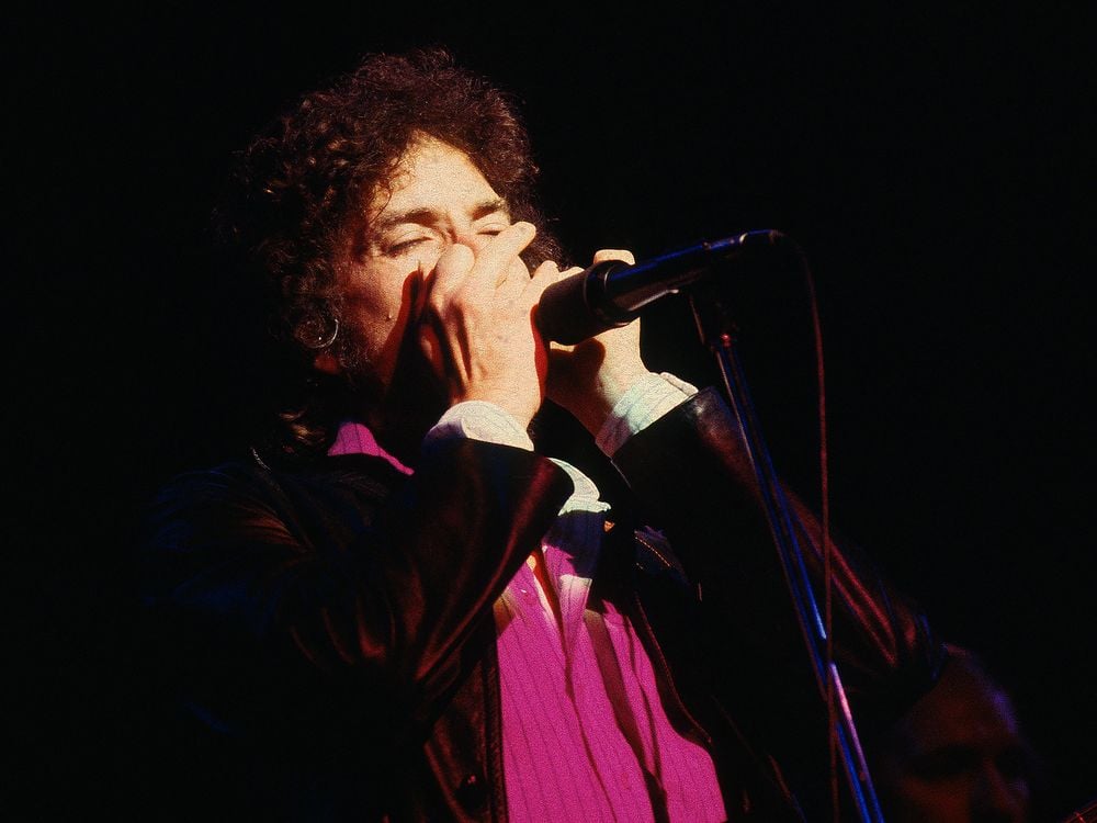 Bob Dylan and his band are performing at the Warfield theater in San Francisco, CA on November 14, 1980.
