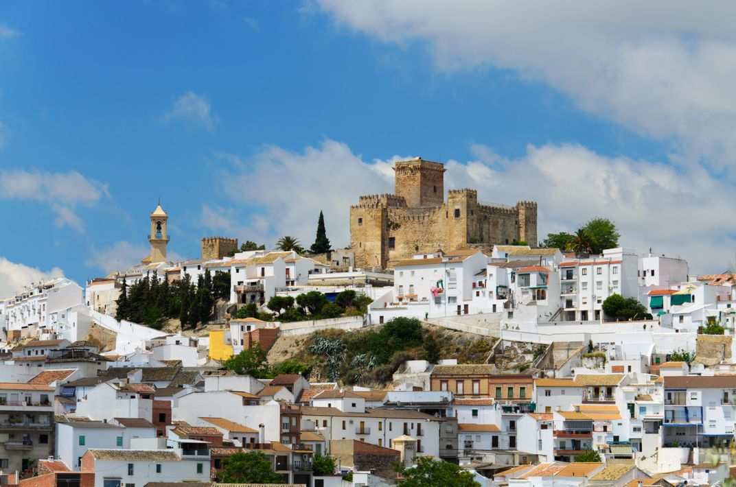 The white hill town of Antequera, with the fortress at center