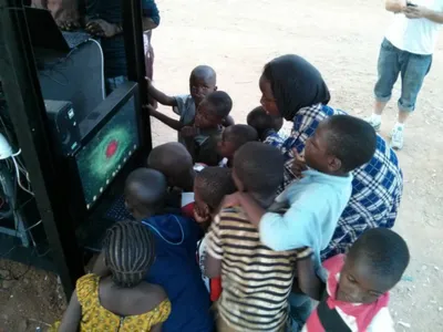 Kids in a small Nigerian village line up to learn at the Hello Hub.