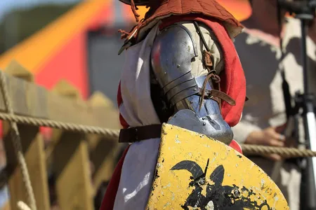A female German fighter rests after competing in the first World International Medieval Combat Championship.