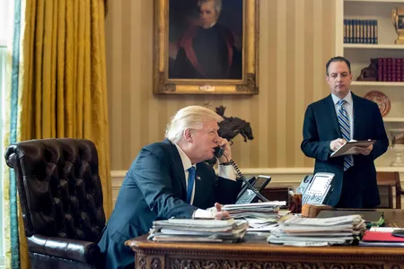 President Donald Trump, accompanied by Chief of Staff Reince Priebus, speaks on the phone with Russian President Vladimir Putin.