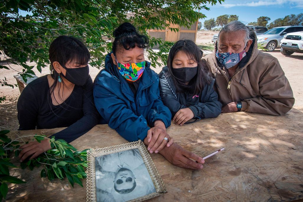Navajo elder Emerson Gorman sits with his family