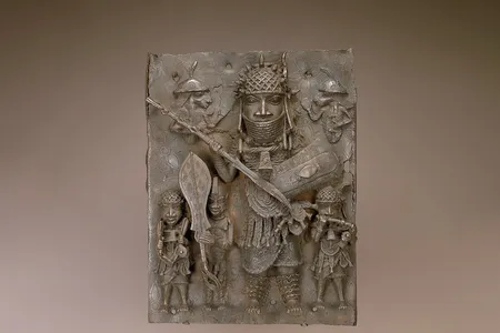 This 16th- or 17th-century copper alloy plaque&mdash;one of the ten Benin Bronzes removed from view&mdash;depicts a&nbsp;high-ranking warrior flanked by&nbsp;musicians and a page holding a ceremonial sword.