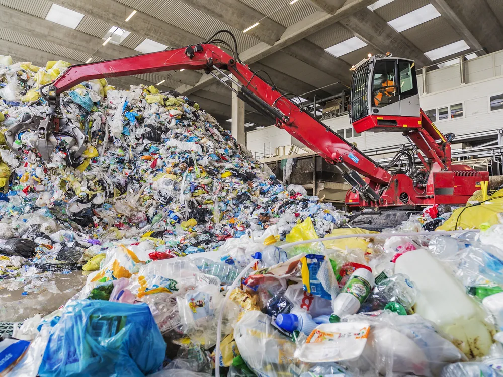 A mechanical grabber in a plastic recycling facility