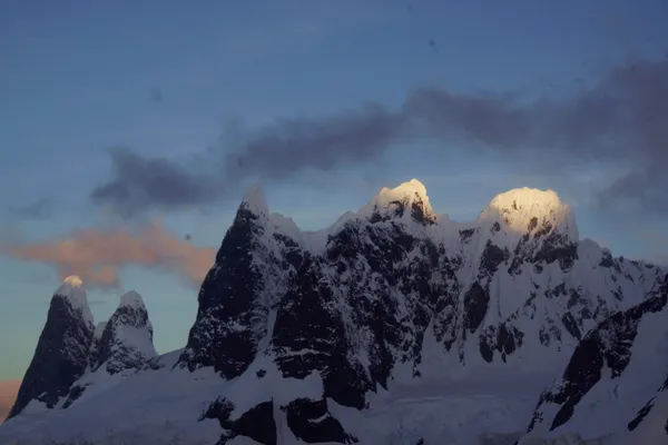 Sunset lights tips of Antarctica mountains.  Camera: Sony A6000. thumbnail