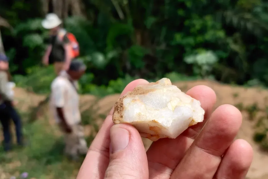 Small stone tool held in a person's fingers