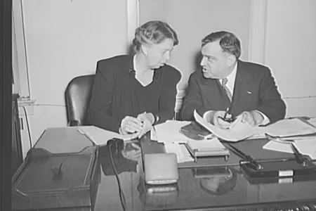 Mrs. Eleanor Roosevelt and Mayor Fiorello H. La Guardia in the latter's office in Washington on the occasion of Mrs. Roosevelt's being sworn in as Mayor La Guardia's assistant in the Office of Civilian Defense.