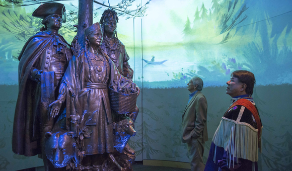 Kevin Gover, director of the National Museum of the American Indian, and Ray Halbritter, Oneida Indian Nation representative and CEO of Oneida Indian Nation Enterprises, at the dedication of the new interpretive sound, light, and imagery around the sculpture “Allies in War, Partners in Peace.” (Katherine Fogden [Mohawk], National Museum of the American Indian)
