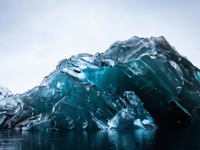 The underside of this recently flipped iceberg is glassy and free of debris.