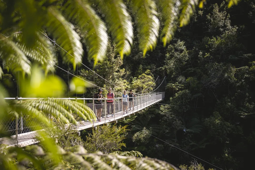 Swinging bridge in the Abel Tasman National Park. Credit: New Zealand Tourism Bureau/Miles Holden