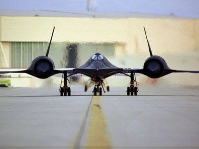 An SR-71 taxis on the ramp.