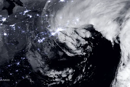 A satellite image shows the huge snowstorm that blanketed the northeastern United States this week. The blizzard was an example of how storms are getting less common but more intense.