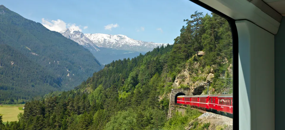  The Glacier Express traveling through a tunnel in the Alps 