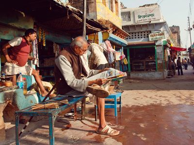 A man reads a newspaper in Chirakoot, India. In nearby Lucknow, researchers observed brain changes in newly literate adults. 