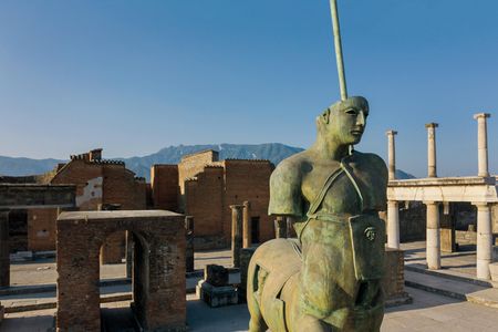In a 21st-century tribute to antiquity, bronze sculptures by the late Igor Mitoraj, including this centaur, grace the public grounds of the archaeological site.