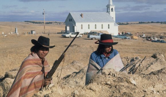Two Natives waiting for the fire fight