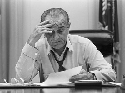 President Lyndon Johnson reviews a speech he will make about the Vietnam War, just weeks before the 1968 election.