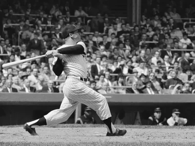 Mickey Mantle of the New York Yankees bats&nbsp;during a game against Baltimore at Yankee Stadium in 1960.
