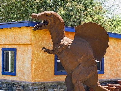 A Spinosaurus sculpture near an ice cream shop in California.