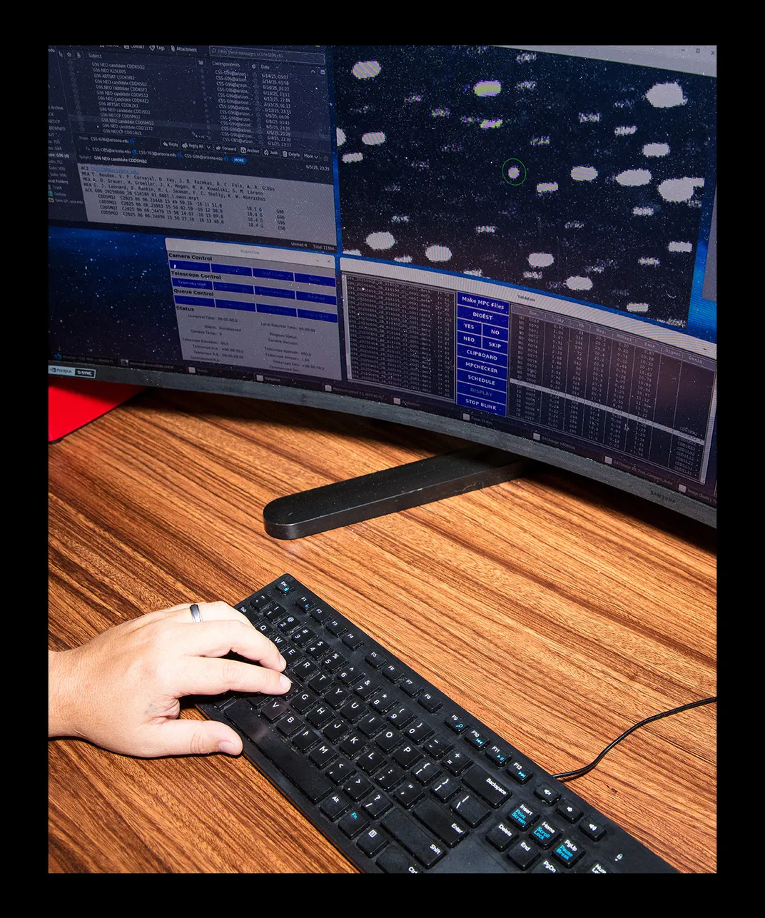 Rankin's hand on a keyboard in front of the computer screen
