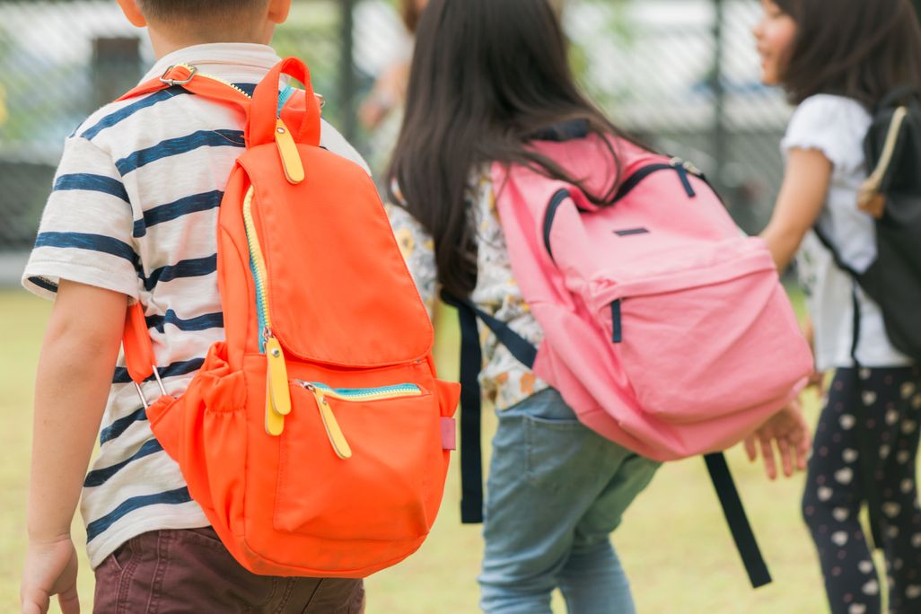 boys and girls with backpacks