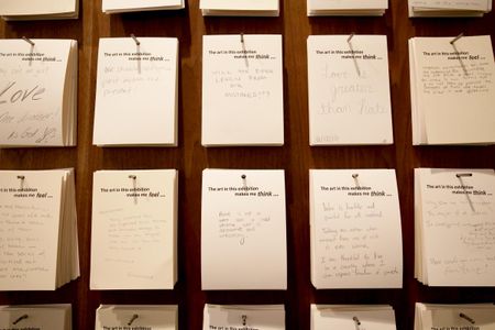 Visitors leave hand-written notes after viewing the exhibition, 