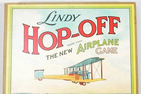 This Parker Brothers game features a Vickers Vimy on the "Lindy" game box and board—the aircraft in which British aviators John Alcock and Arthur Brown made their non-stop transatlantic flight in 1919. Perhaps a similar game existed before Lindbergh's solo flight in his Ryan monoplane. 
