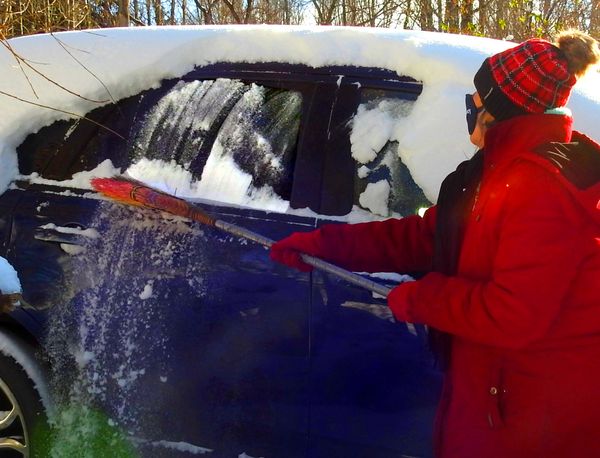 Sweeping Snow off the Car Window thumbnail