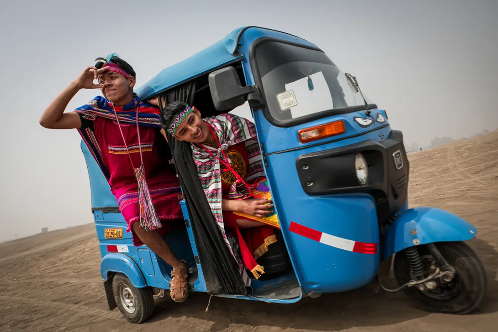 This photograph was born from my fascination with Andean heritage and the way it coexists with everyday life. I was inspired by these two young men wearing colorful clothing reminiscent of the Incas, captured in a simple moment inside a motorcycle taxi.

I wanted to show how tradition and modernity intersect in a smile, in a curious look at what is happening outside the vehicle. My intention is for the viewer to feel the vitality, pride, and joy that Peruvian youth convey, while also reflecting on the cultural strength that survives in the details of urban life.

I chose photography as my medium because it allows me to capture this intersection of time: the ancient past and the energy of the present sharing the same space.