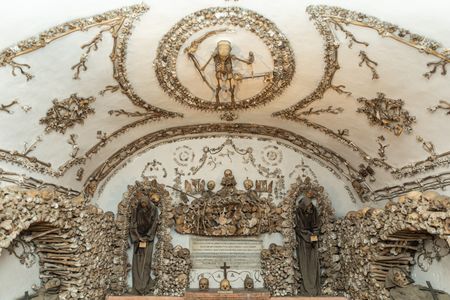 Skeletons adorn the walls and ceilings of the crypt, like 3D paintings.