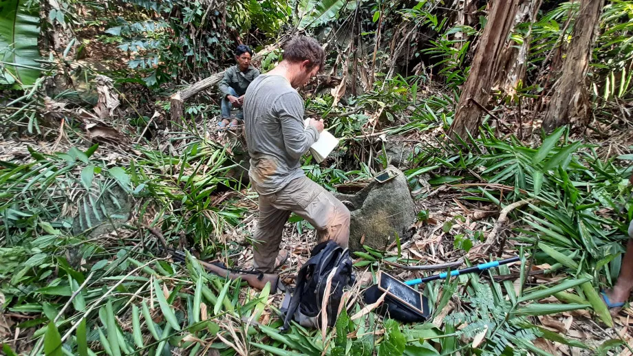 Nicholas Skopal surveying a jar site in Laos