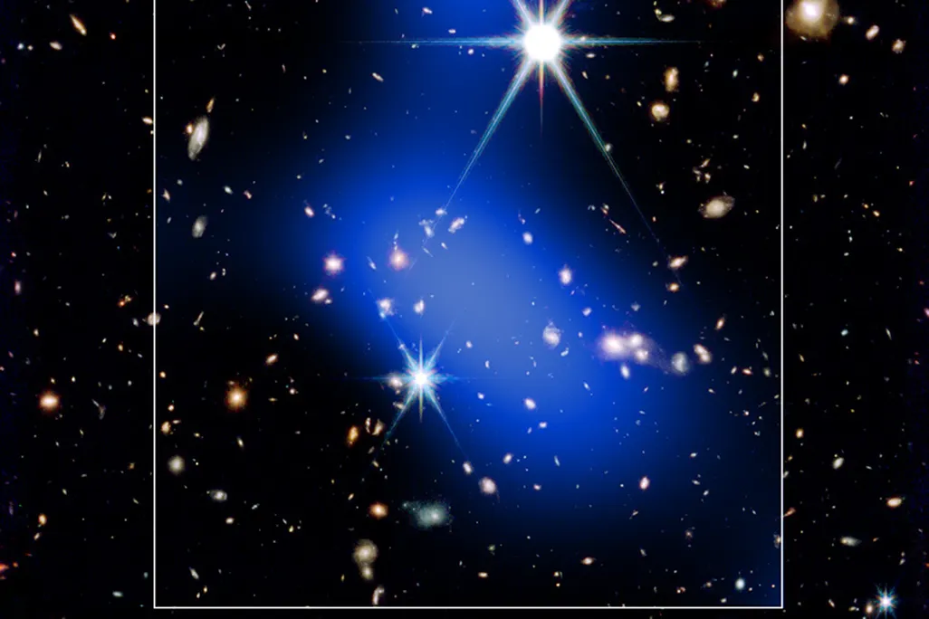 several shining galaxies with a blue cloud in the center