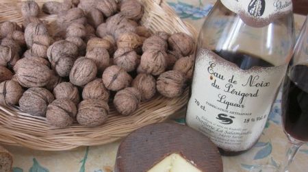 A tabletop laden with goodies showcases the nut culture of the French Périgord, where locals make cheese, bread, oil and liqueur using the area’s walnuts.