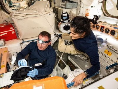 Astronauts Butch Wilmore and Suni Williams inspect safety hardware aboard the ISS in August 2024.