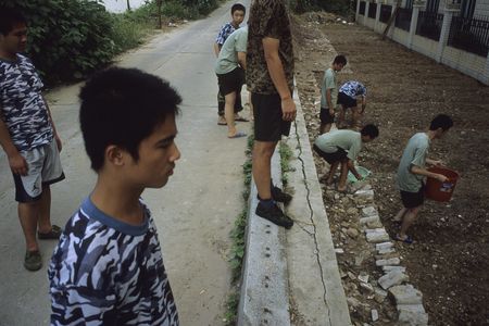 Patients at an internet addiction boot camp in Guangzhou practice gardening. 