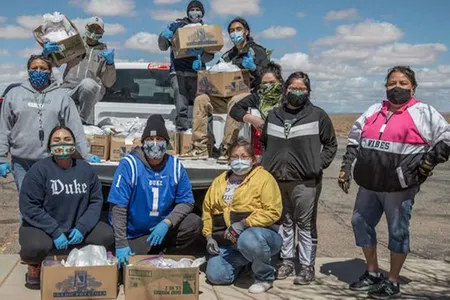 Volunteers with the Navajo & Hopi Families Covid-19 Relief Fund distribute food and other essential supplies to isolated communities and farmsteads on Navajo Nation and Hopi lands. As part of the Smithsonian's virtual program 24 Hours in a Time of Change, Shandiin Herrera (Diné)—seated on the left, wearing a Duke University sweatshirt—describes how this grassroots response to the COVID-19 pandemic came together last March and shares her experiences as the fund's volunteer coordinator in Monument Valley, Utah. 