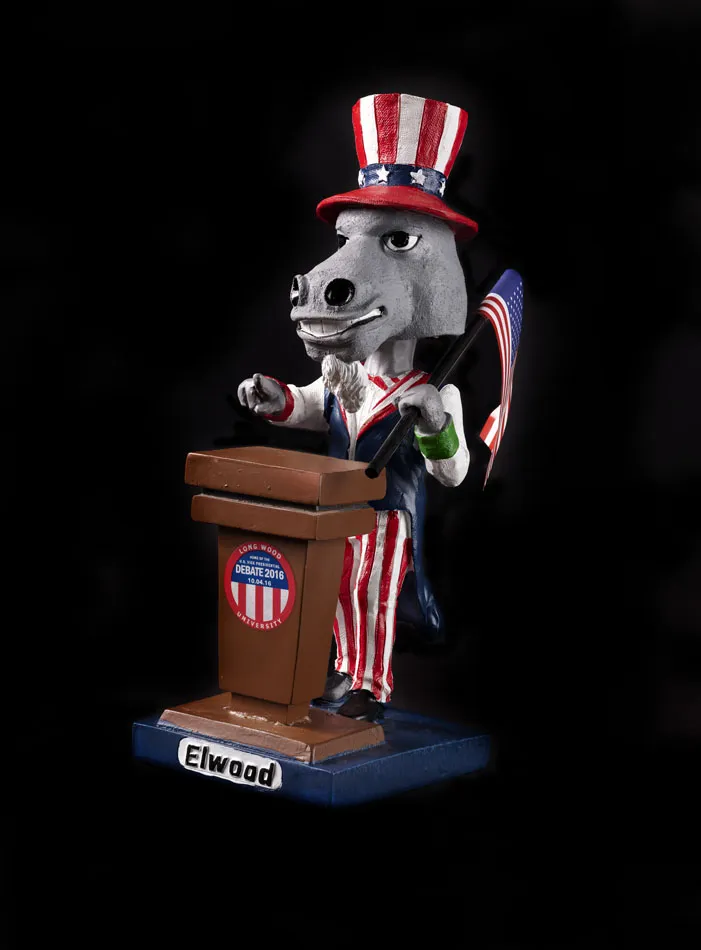 Donkey bobblehead dressed as Uncle Sam stands behind a podium