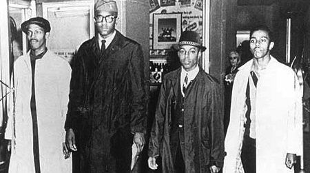 Ezell A. Blair, Jr. (now Jibreel Khazan), Franklin E. McCain, Joseph A. McNeil, and David L. Richmond leave the Woolworth store after the first sit-in on February 1, 1960.